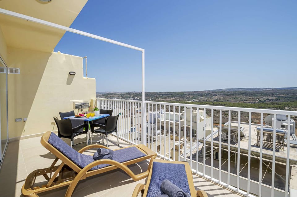 Sunny Terrace with panoramic and distant seaviews. 