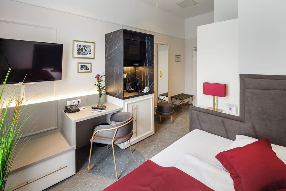 Hypo-allergenic bedding, free minibar items, in-room safe