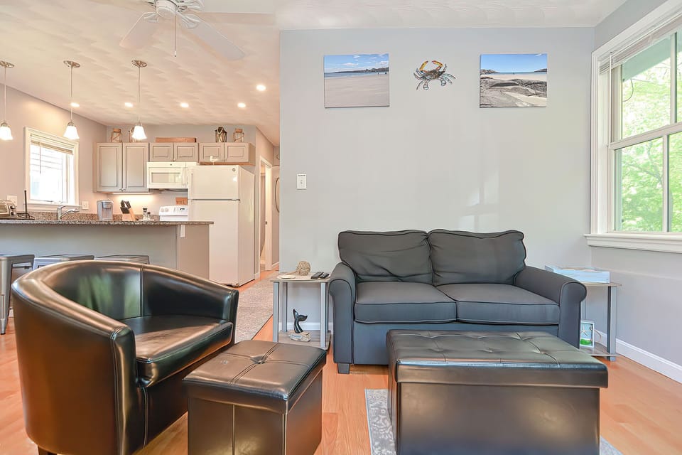 There is an open-plan living, dining, and kitchen.