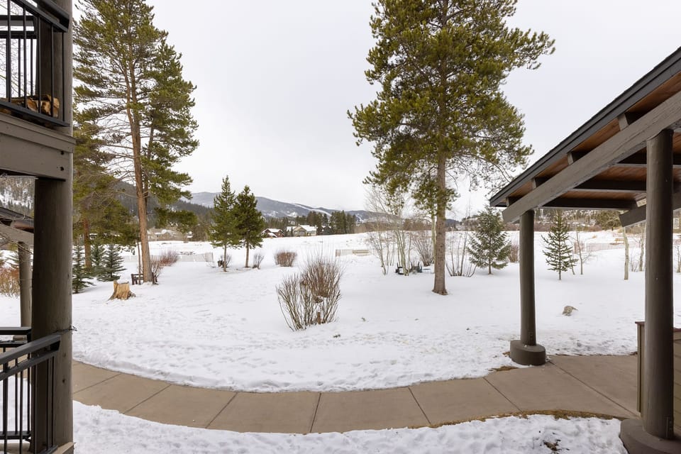 Scenic mountain views surround the building.