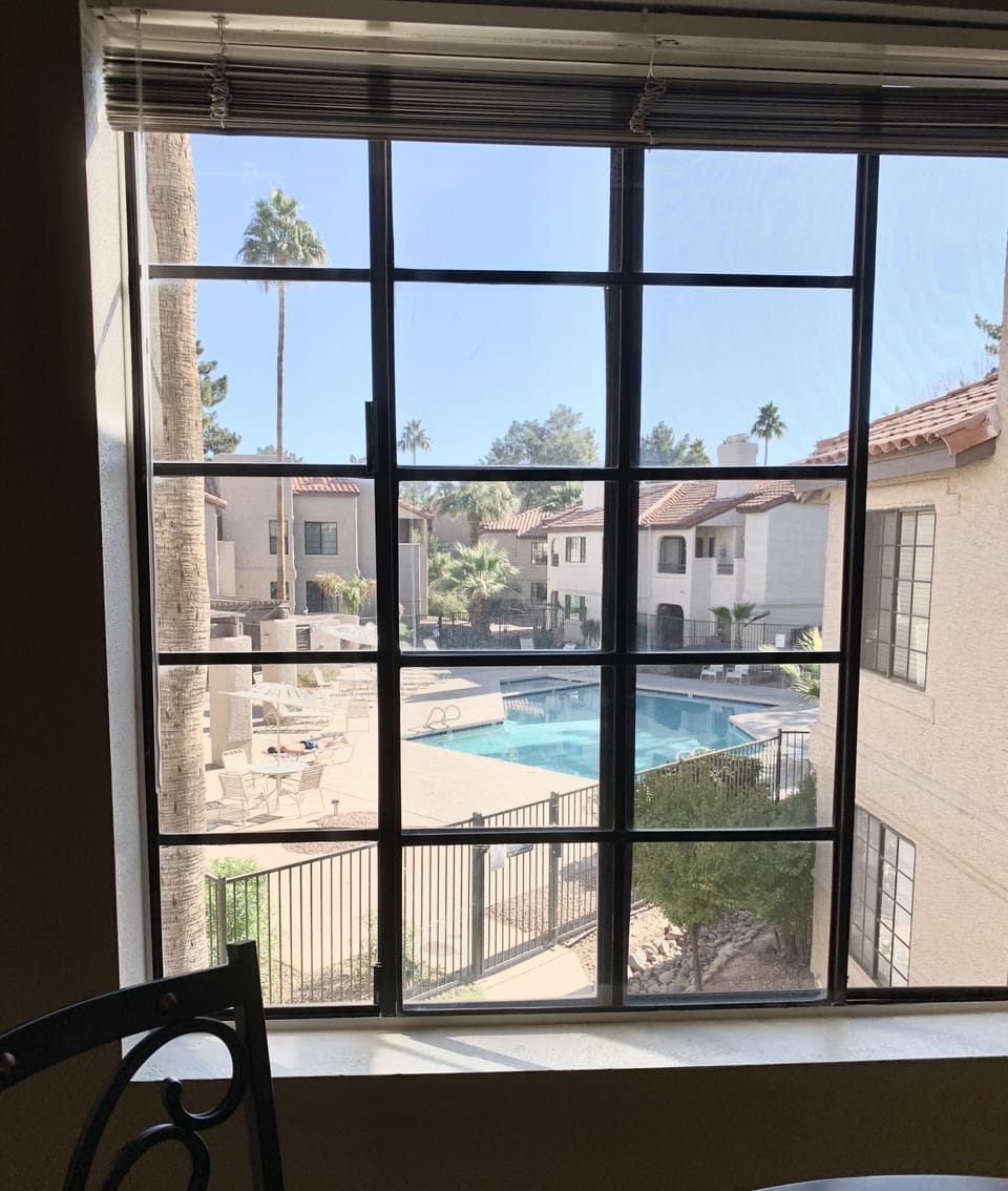 Pool just steps outside unit and view from dining area
