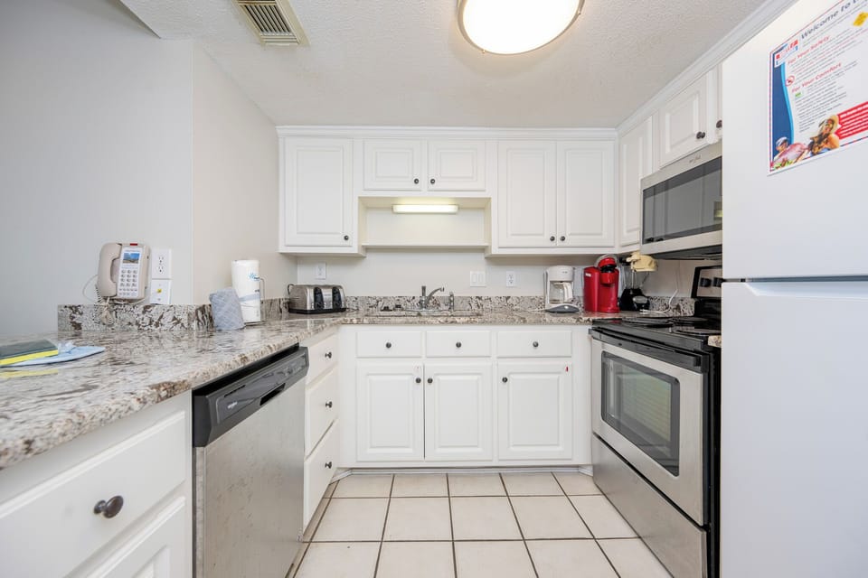 Craft delightful snacks using the spacious counter as you savor the inviting vibe of this charming kitchen