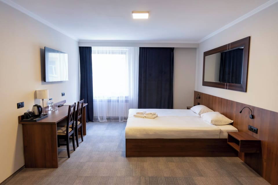 Family Room (No AC) | Desk, blackout drapes, iron/ironing board, free WiFi
