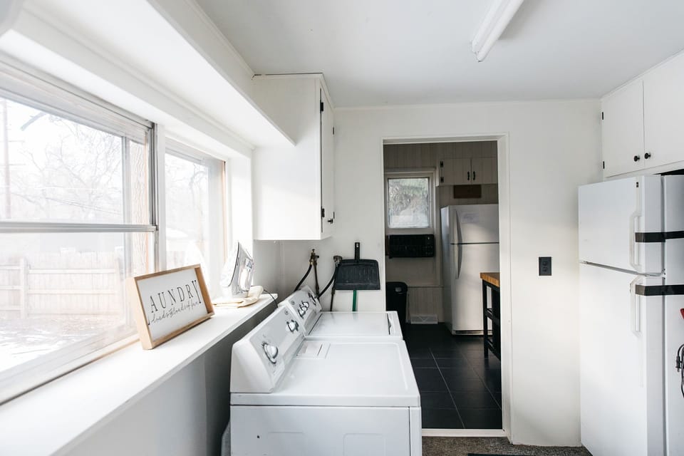 Main floor laundry. (Second fridge has been removed).