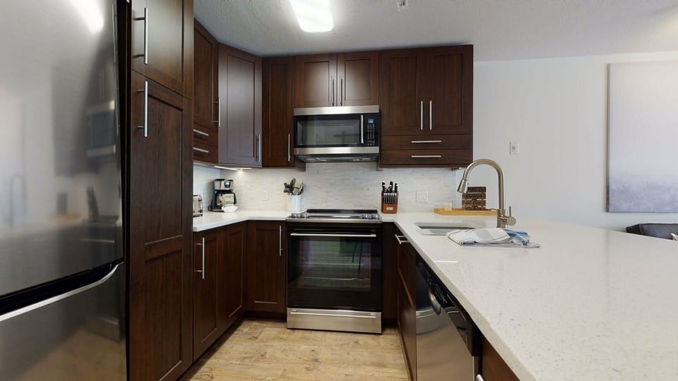 Whip up meals with ease in the fully stocked kitchen with modern finishes.