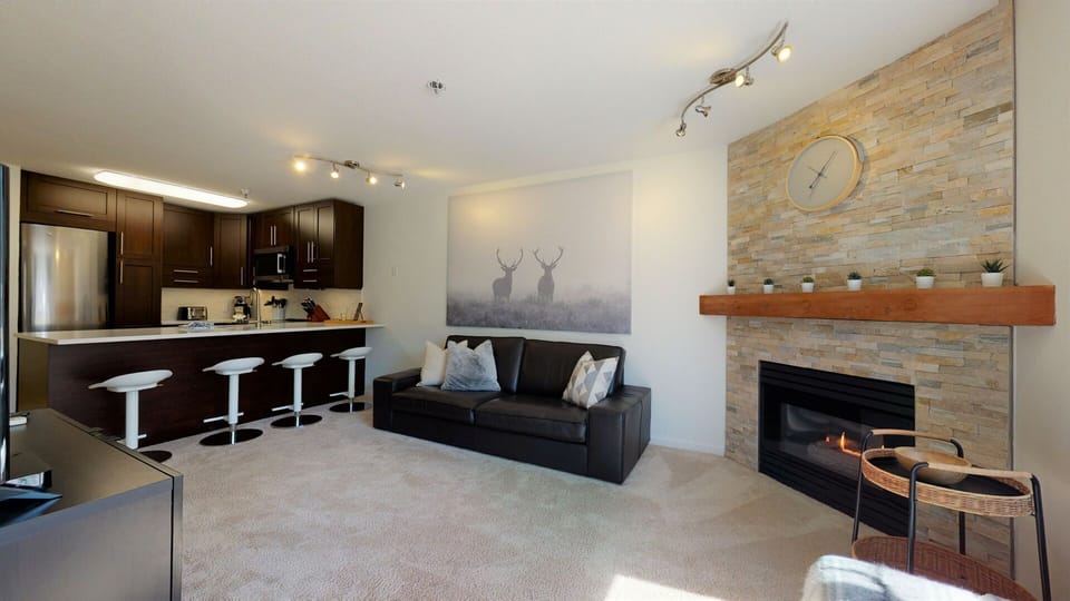 Relax in the spacious living area with Smart TV, gas fireplace, and A/C.