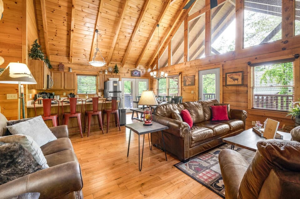 Open concept main living area with 2 story A-framed windows.