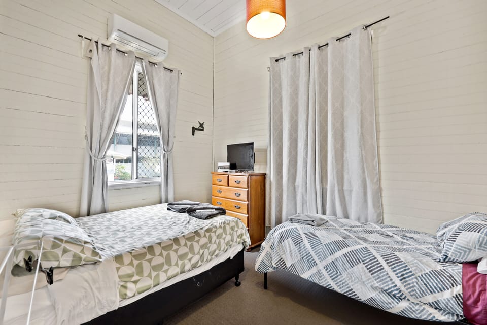 Versatile Twin Bedroom – Queen + Rollaway Single