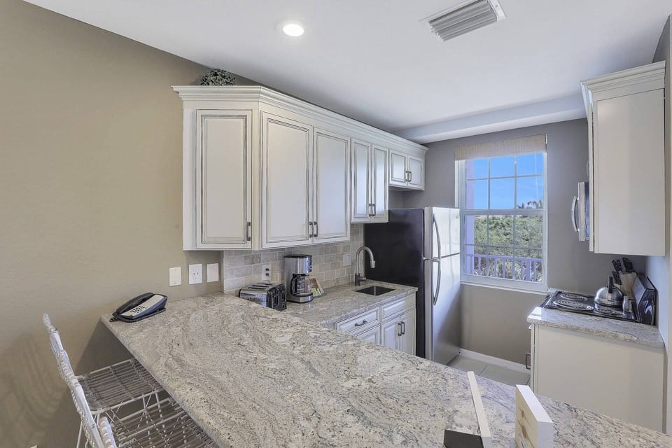 Enjoy granite countertops and stainless steel appliances.