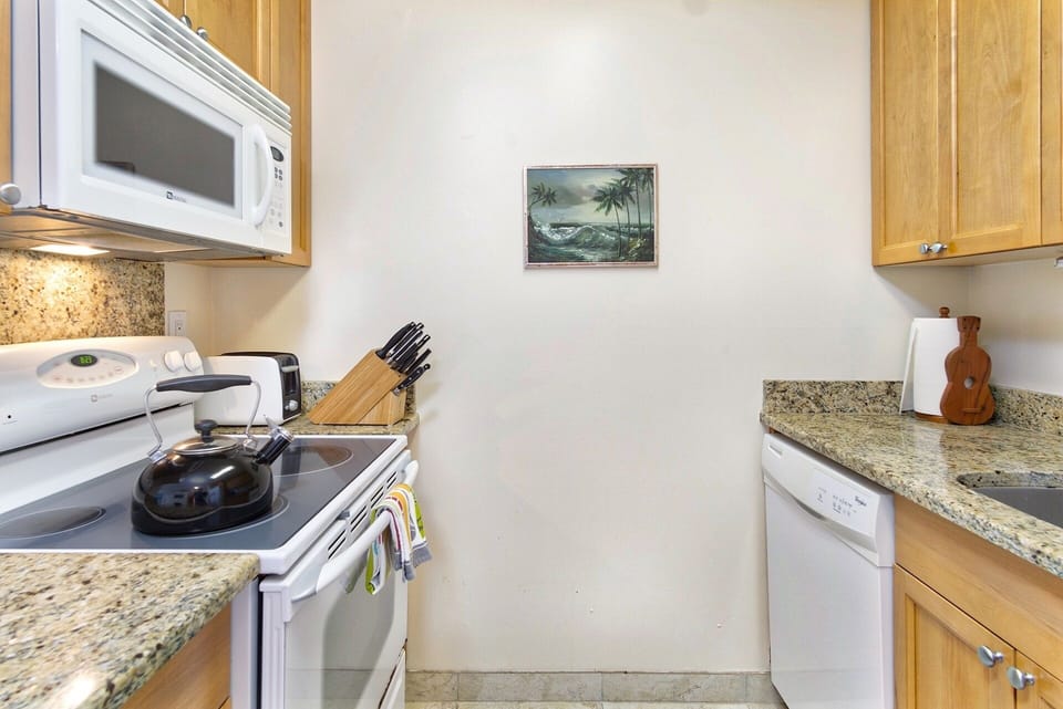 Upgraded kitchen with fresh finishes and island-inspired details perfect for preparing meals at home.