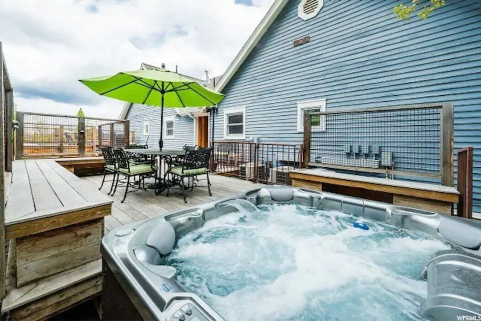 Shared 8-person hot tub, dining area, BBQ and deck.