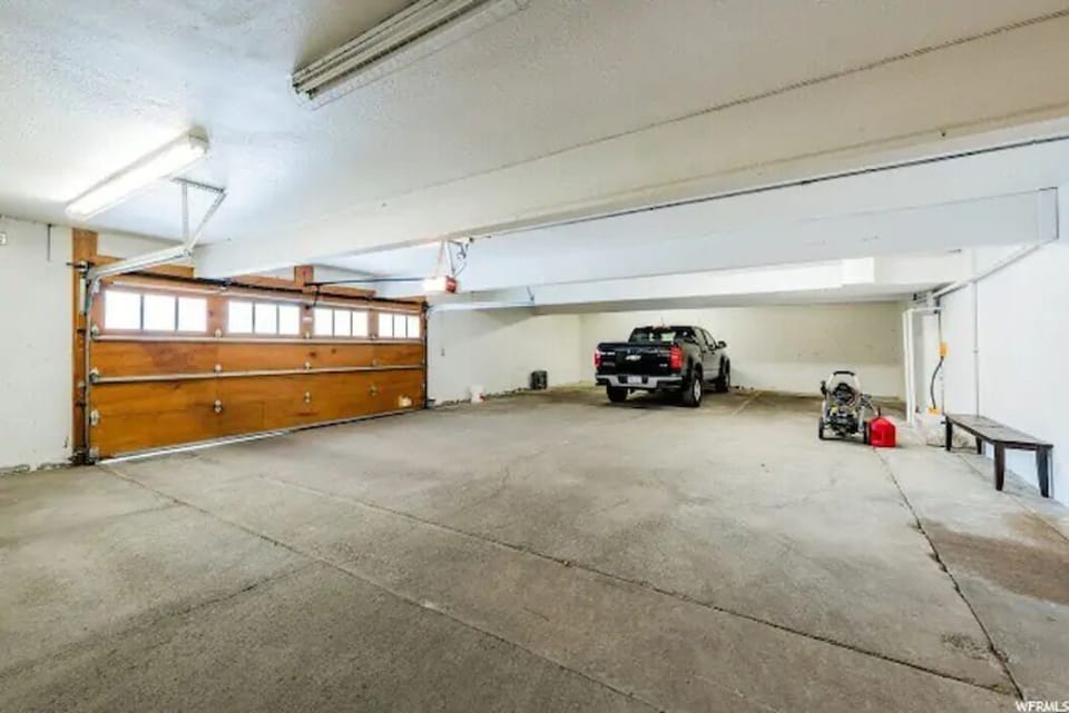 Six car shared garage with indoor access and radiant heated driveway.