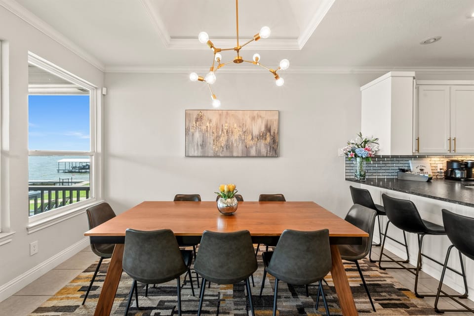 Dining room adjacent to the kitchen, plus counter-height stools for casual meals and conversation.