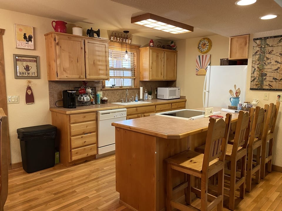 Kitchen area with counter barstools