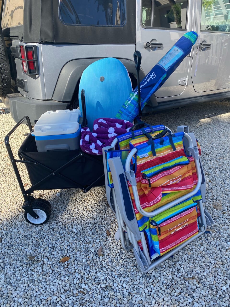 Cart, coolers, umbrella, body boards, 2 kayaks, & 4 beach chairs provided