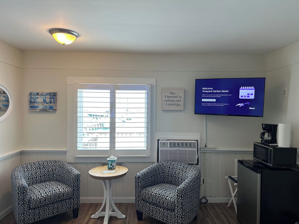 Beach View Room with Deck Access | Living area | 45-inch Smart TV with digital channels