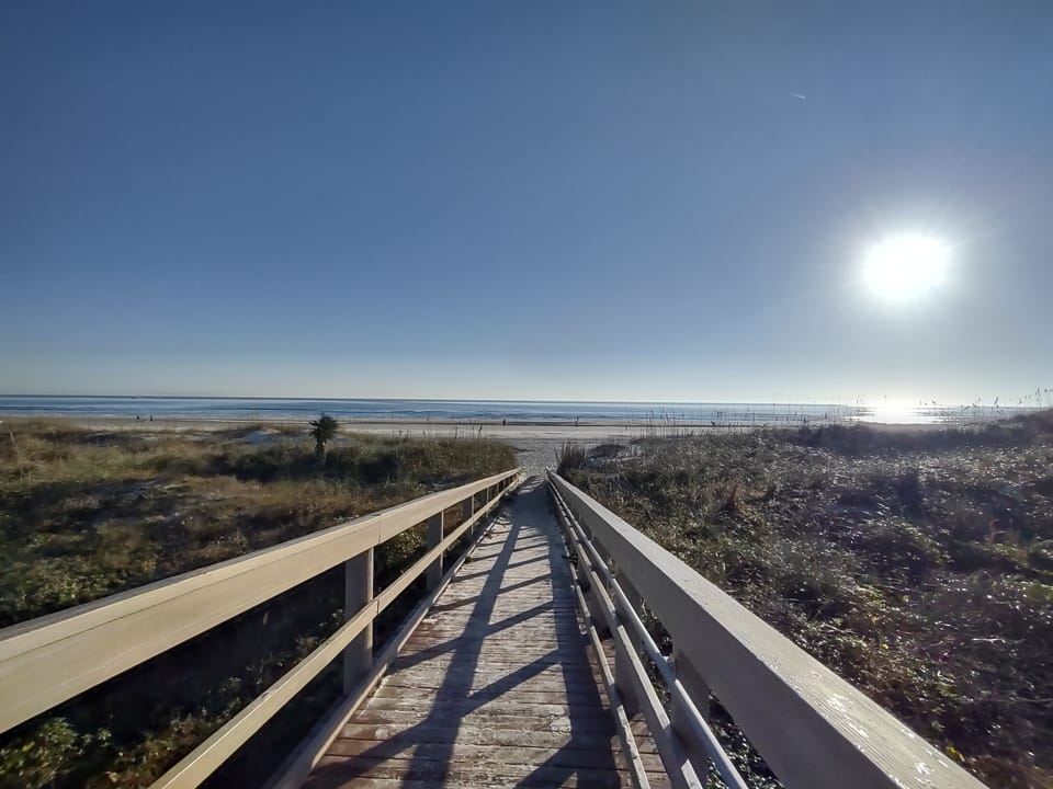 Gated boardwalk to the beach.  Perfect walks/run on the beach.