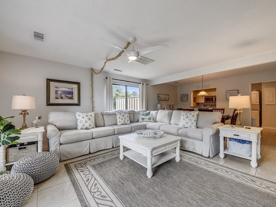 Living Room with Large Sectional Sofa at 680 Queens Grant