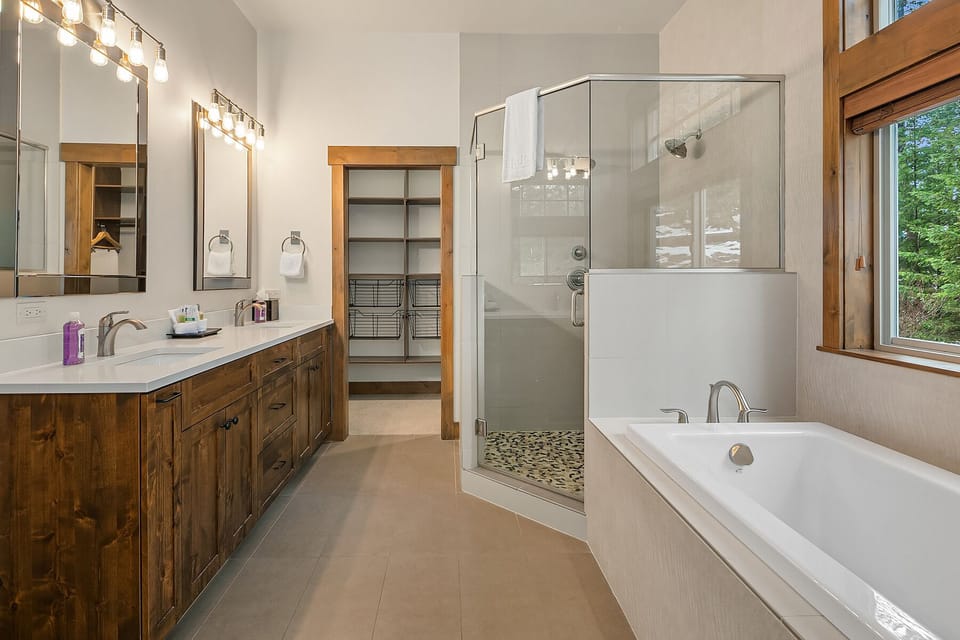 Eagle Aerie: - Master bath with a soaking tub and a large shower with dual heads.