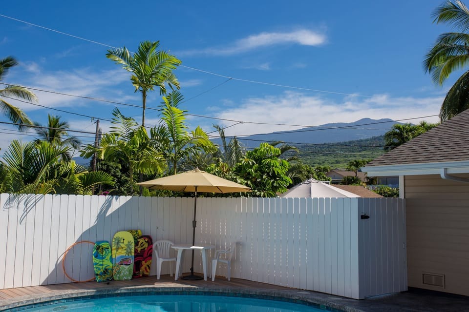 Mountains and boogie boards. Comfortable loungers and shaded seating areas perfect for sunbathing, reading, or enjoying a tropical drink.