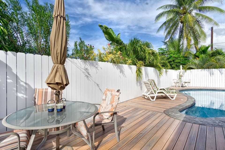 Relax in your own private pool surrounded by mature landscaping and multiple seating options for ultimate privacy and comfort.