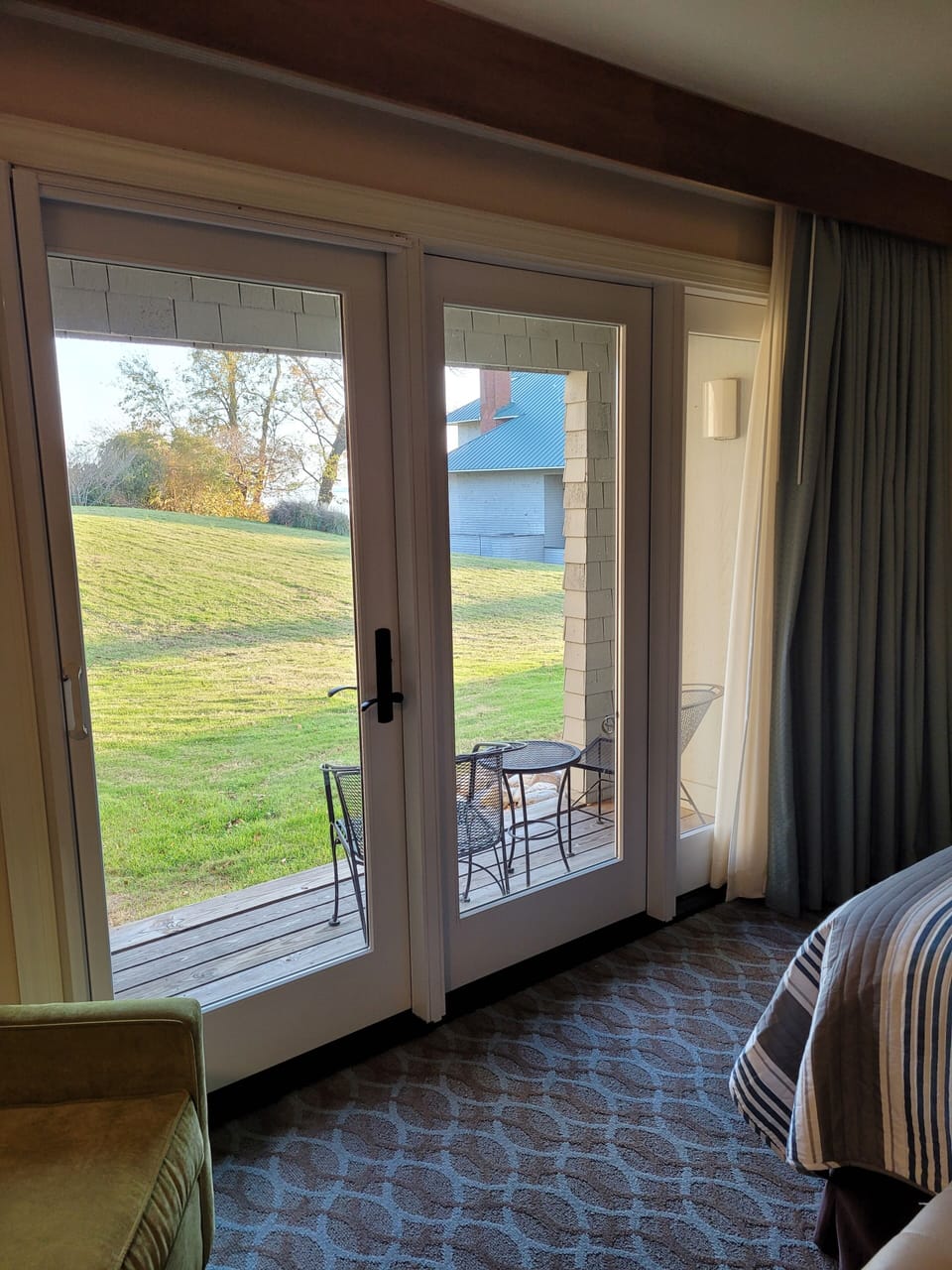 Private deck with view of the James River and an open, grassy area