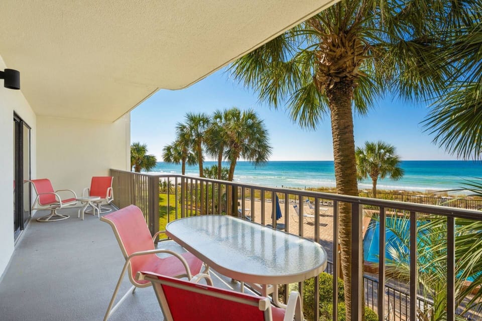 Enjoy a seat at the table and chairs on a private balcony with beautiful gulf views