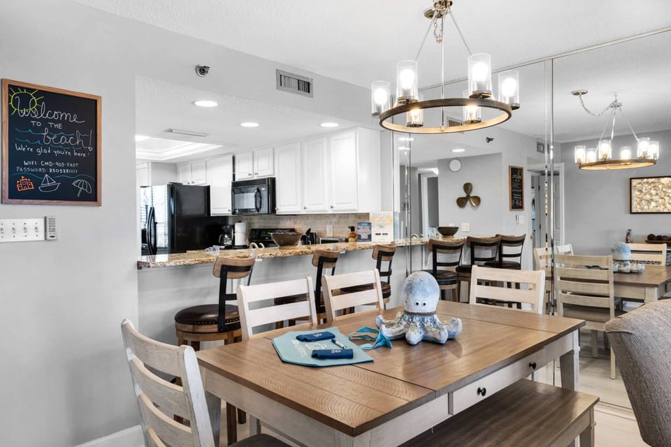 The open dining space offers table seating for six and bar seating for three