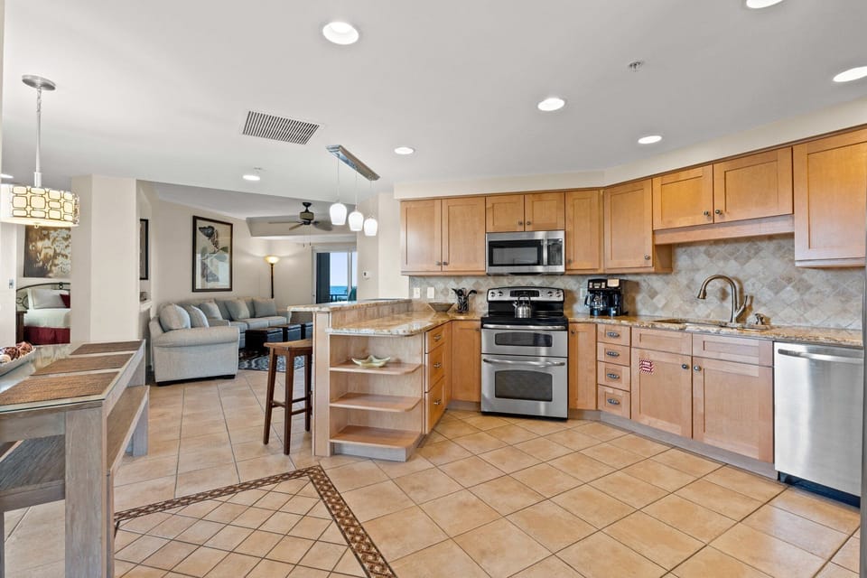 Sleek full kitchen with tile floors and stainless steel appliances, ready for your culinary creations.

Professionally Managed by
Breathe Easy Rentals
