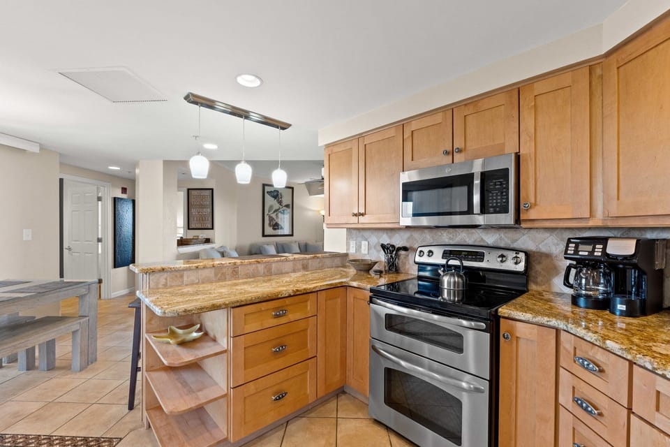 Modern kitchen featuring stainless steel appliances and tile flooring, designed for style and function.
Professionally Managed by
Breathe Easy Rentals