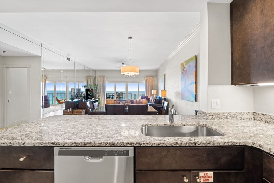 Fully stocked kitchen open to dining & living room.