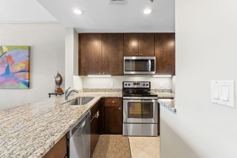 Remodeled kitchen with granite counters & modern design.