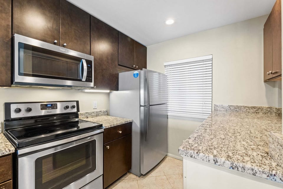 Kitchen with bar seating for 2 & open floor plan.