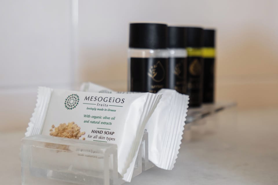 Designer toiletries, hair dryer, bathrobes, slippers