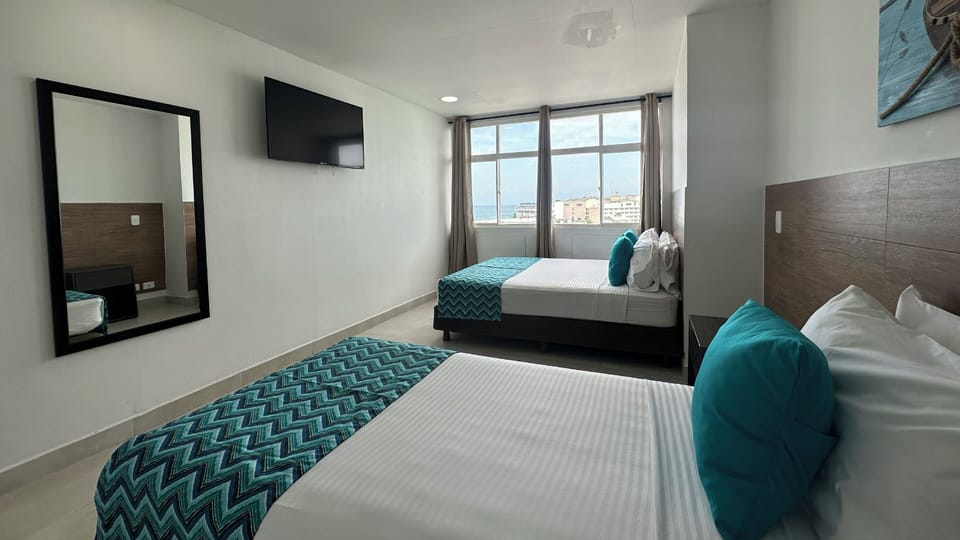 Family Triple Room | In-room safe, bed sheets