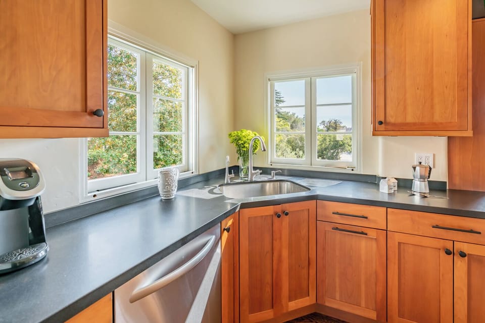 Spacious kitchen with bright open windows