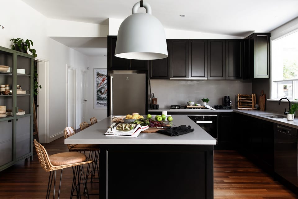 Our kitchen with large island bench, dual Miele ovens and loads of prep space