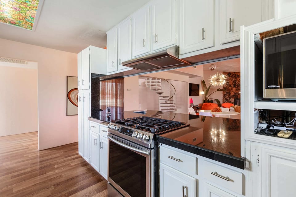 Open concept floor plan means you can still get the lowdown while fixing up some boss snacks.