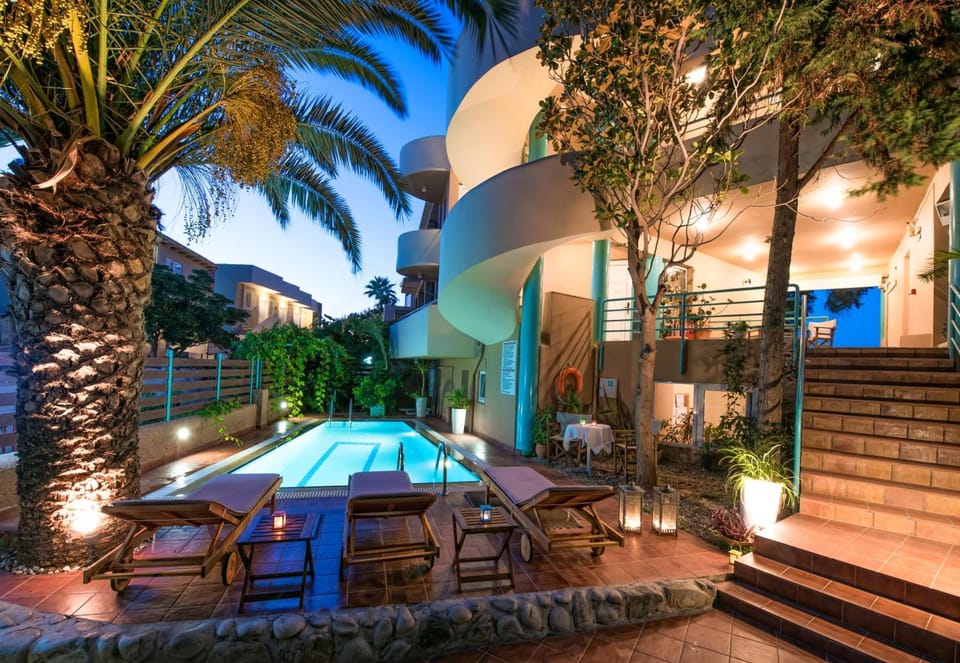 Seasonal outdoor pool, open 11:00 AM to 6:00 PM, sun loungers