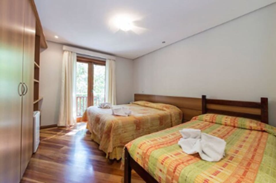 Triple Room | Minibar, blackout drapes, iron/ironing board, free WiFi