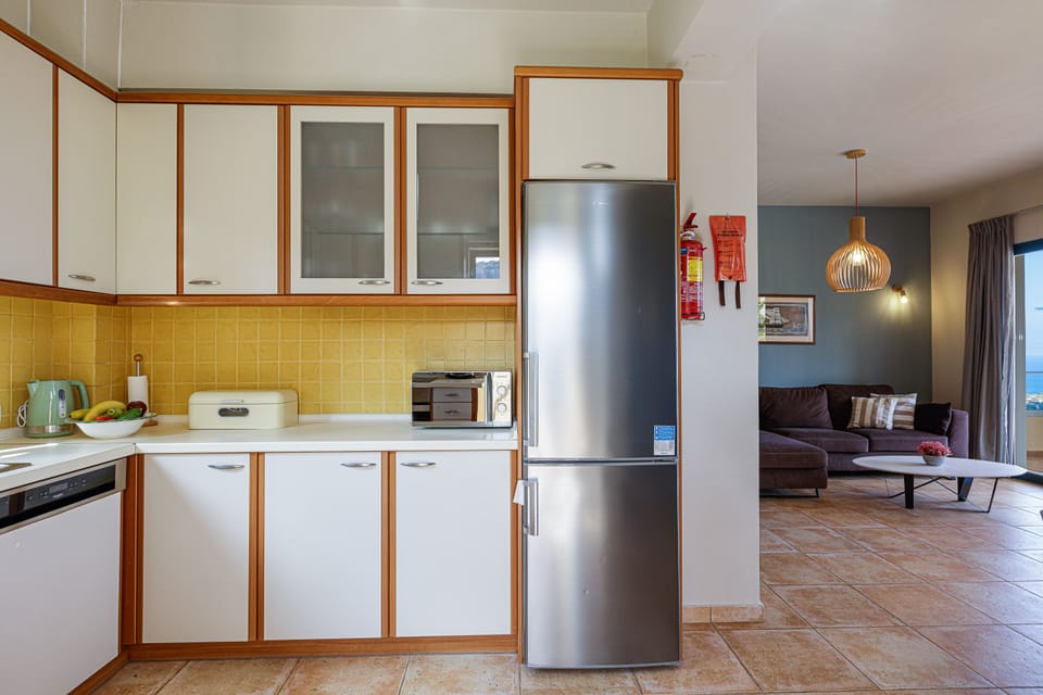 The kitchen is next to the dining area and living room.