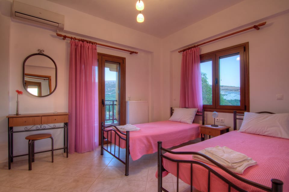 The second twin bedroom has access to the balcony.