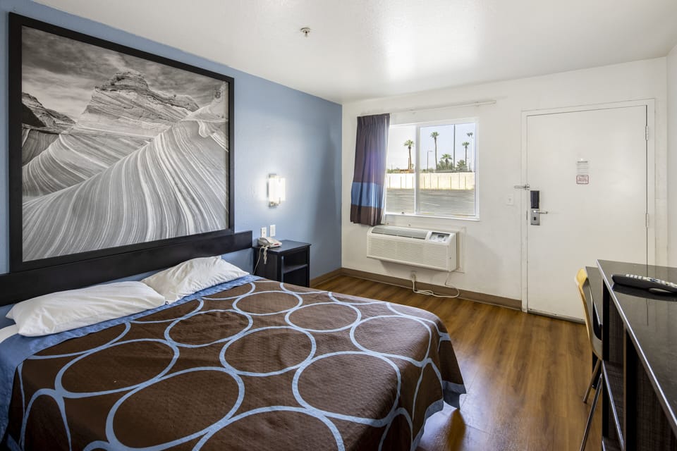 Desk, blackout drapes, bed sheets