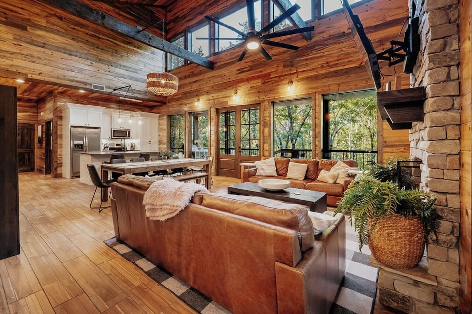 The heart of the home! Our spacious open-concept living area features plush leather seating, a cozy fireplace, and floor-to-ceiling windows that bring in natural light and breathtaking views.
