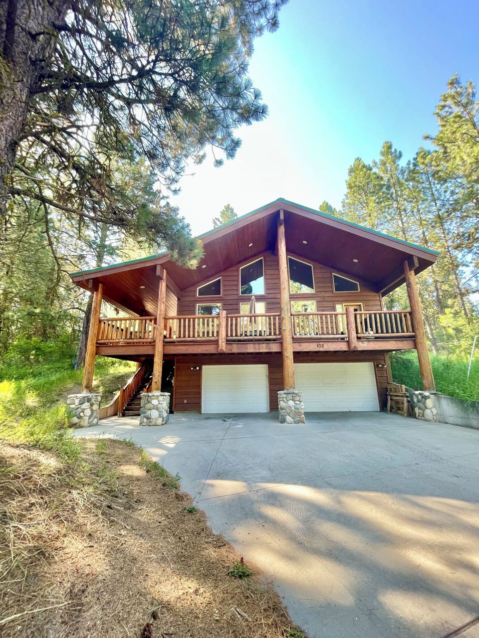 Front of home, driveway, large deck. Garage is not accessible for guests