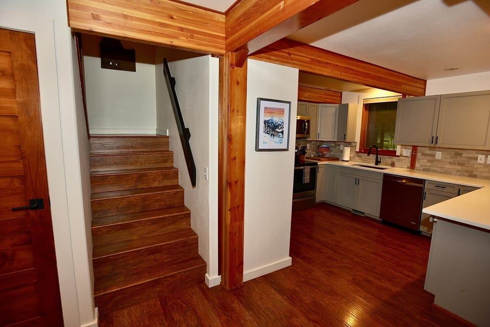 Stairs to second floor off of kitchen