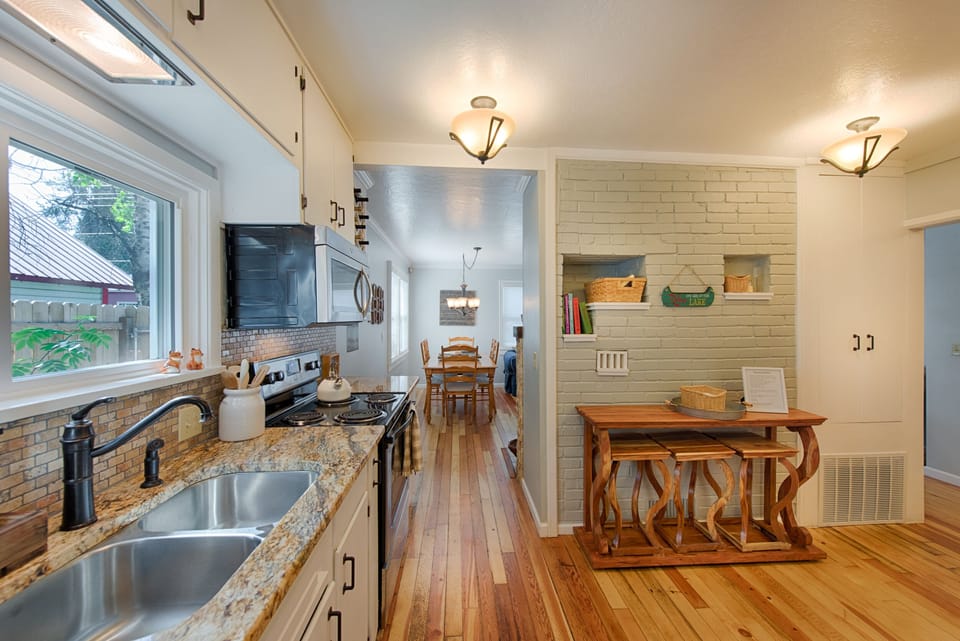 Granite counter tops.  Kitchen work or dining space.