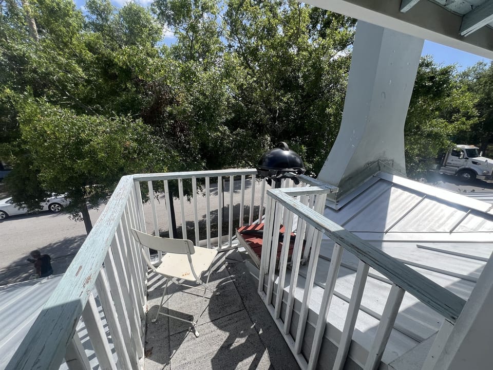 Small outdoor area in the trees with Grill
