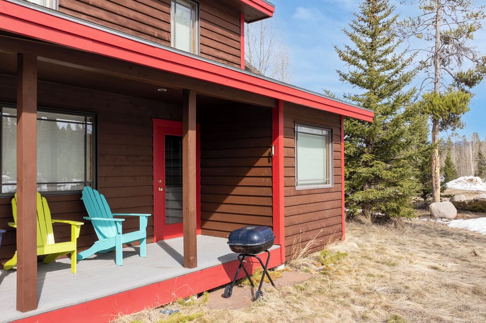 Step onto your private covered porch where colorful Adirondack chairs and a BBQ grill await your mountain getaway moments.