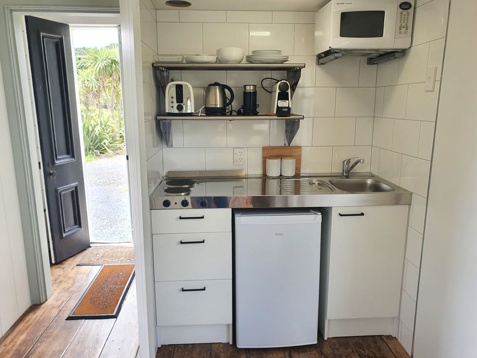 Kitchenette has a hotplate, fridge & microwave